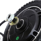 Close-up of a black wheel with a metal hub and bolts on a white background