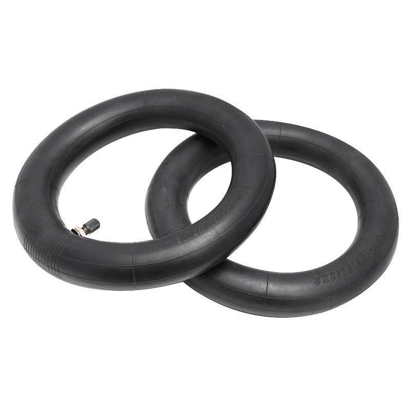 Two black inner tubes on a white background