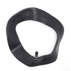 Black inner tube with valve on a white background